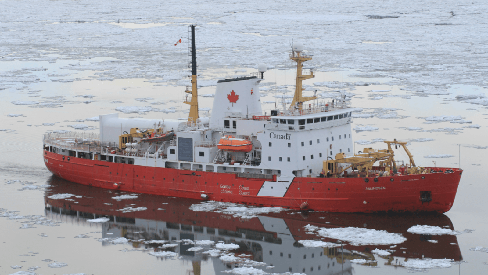 Icebreaker navigating sea ice in Canada's Arctic, where infrastructure must withstand extreme conditions